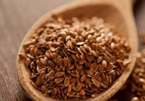 Flaxseeds In wood spoon